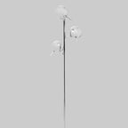 Modern floor lamp with three silver shades on a grey background