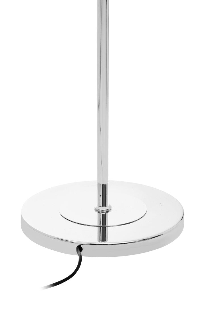 Chrome floor lamp with a round base on a white background