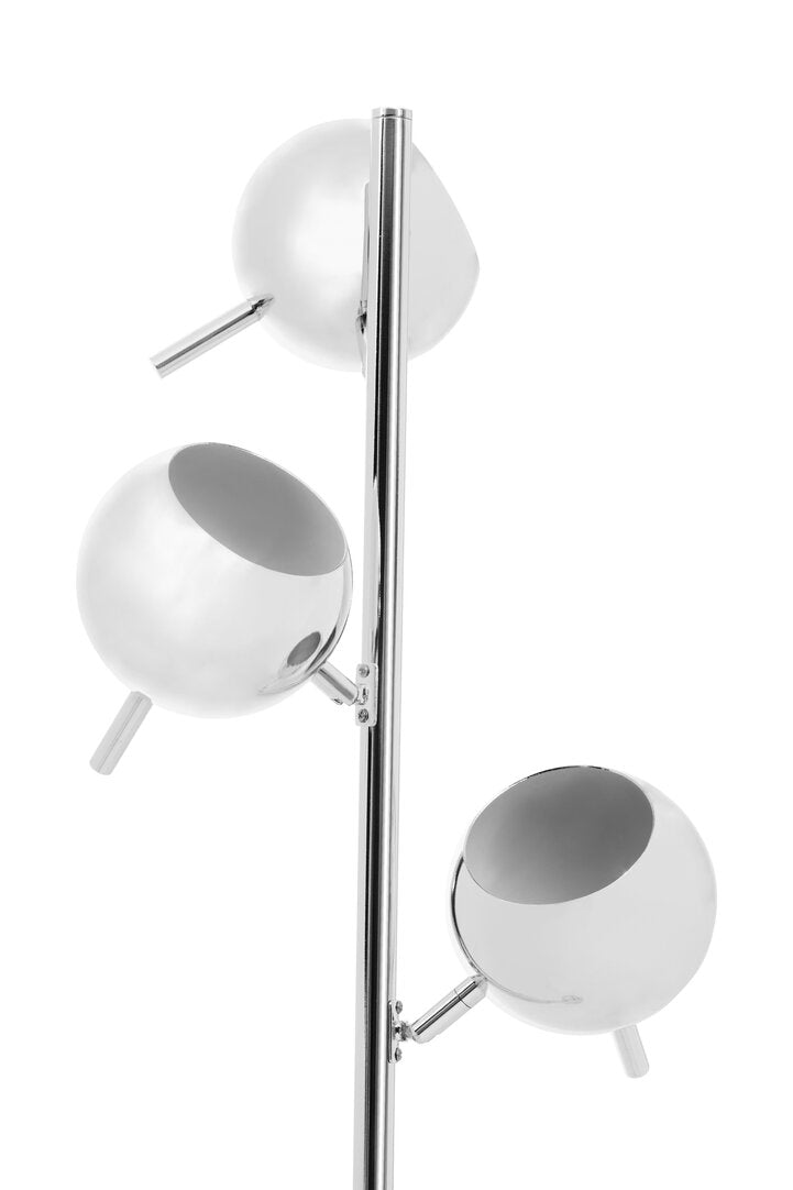 Modern floor lamp with three white spherical shades on a white background