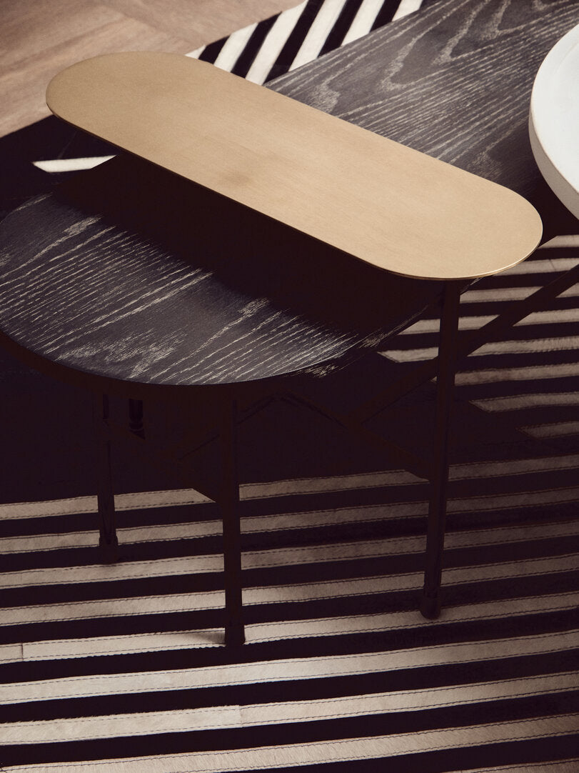 3 Tiered Black Gold and Stone Coffee Table on geometric rug