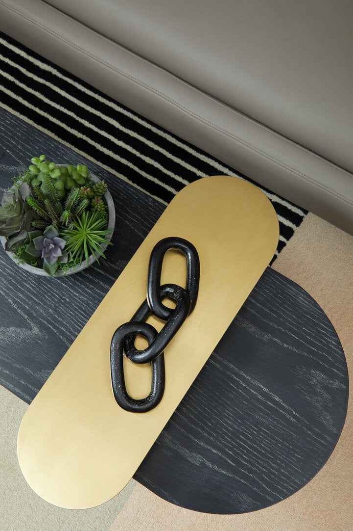 3 Tiered Black Gold and Stone Coffee Table on geometric rug