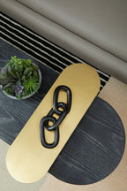 3 Tiered Black Gold and Stone Coffee Table on geometric rug