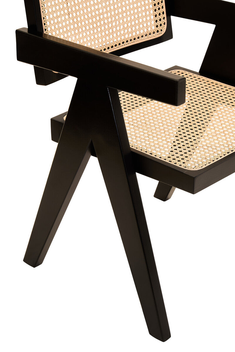 Black chair with woven cane seat and backrest on a white background