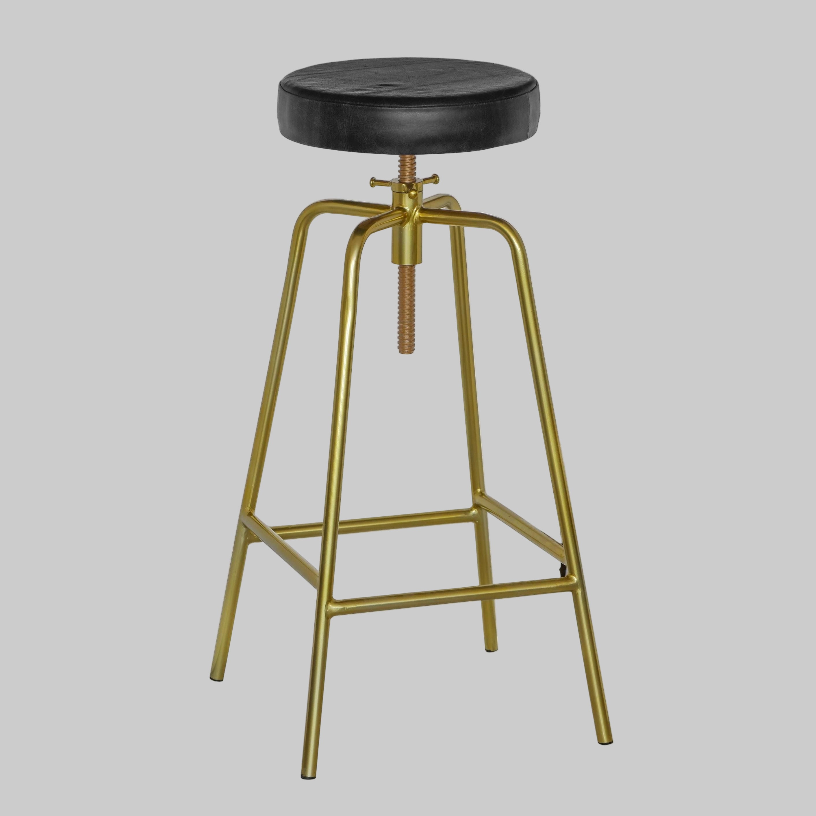 Bar stool with black seat and gold metal frame on a white background