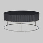 Round Black coffee table on stainless steel  base on grey background