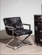 Chrome Cross Leg Chair with white upholstery next to cupboard