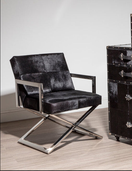 Chrome Cross Leg Chair with white upholstery next to cupboard