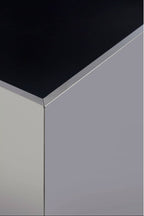 Corner of a black and silver rectangular side table