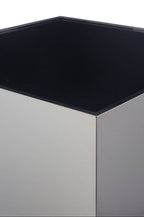 Square black glass top on a metallic base against a white background