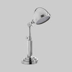 Chrome desk lamp on a gray background