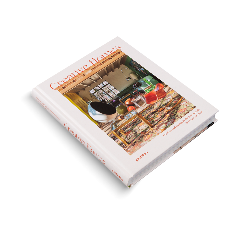 Book titled 'Creative Homes' on a white background