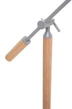 Movable lamp joint with wooden legs and grey metal joints on a white background