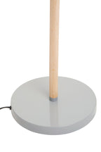 Floor lamp with wooden pole and gray concrete base on a white background