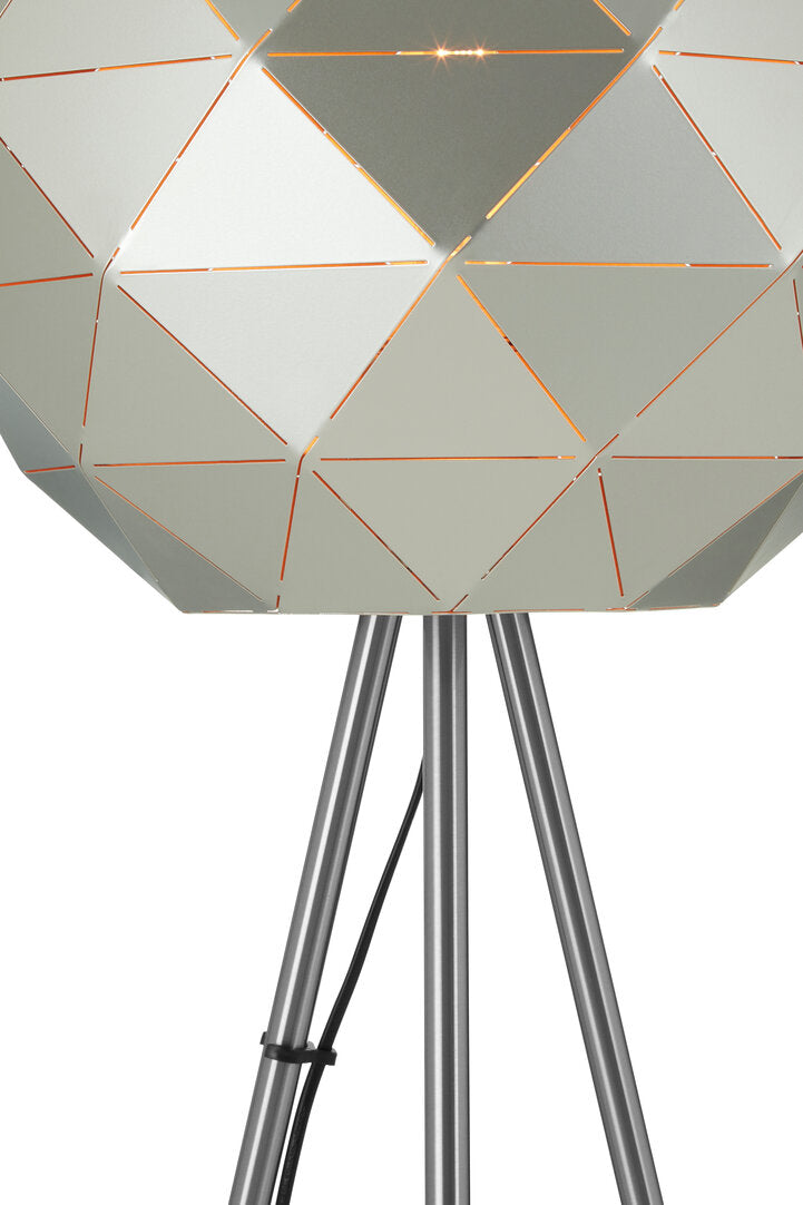 Geometrically patterned lamp with metallic legs on a white background