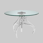 Glass table with a transparent metal base on a gray background