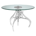 Glass top table with chrome metal base on a white background