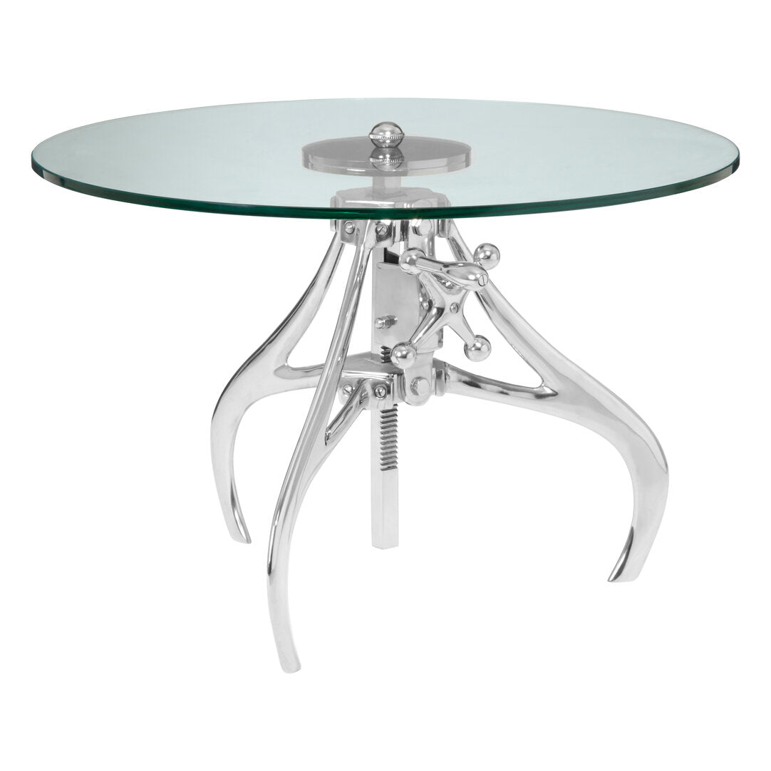 Glass top table with chrome metal base on a white background