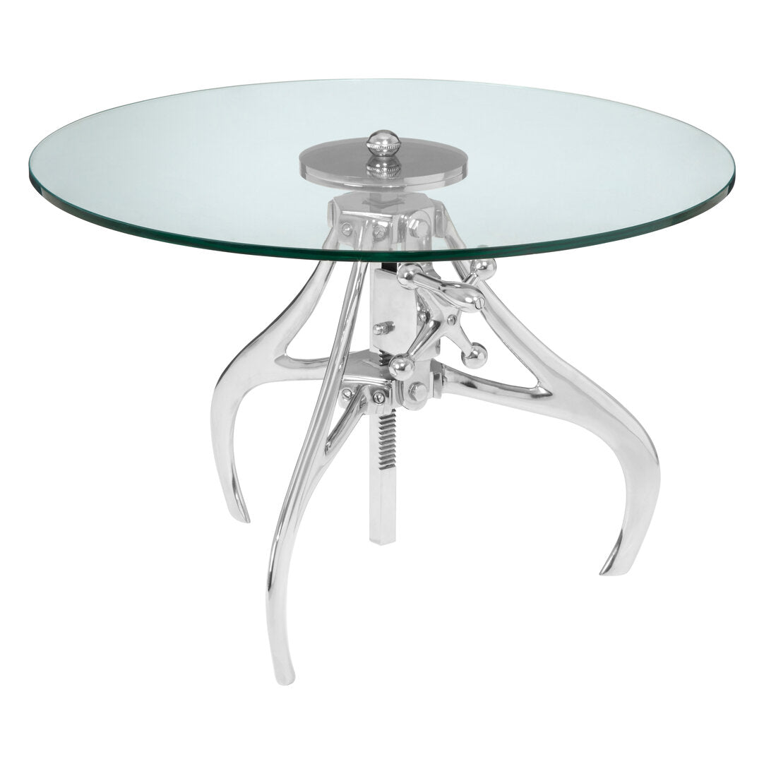 Glass round table with chrome metal base on a white background