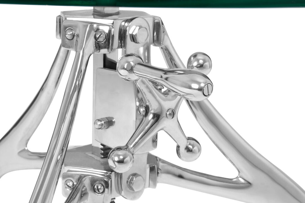 Close-up of a metallic crank for table on a white background