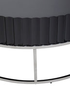 Detail of Round Black coffee table on stainless steel  base on white background