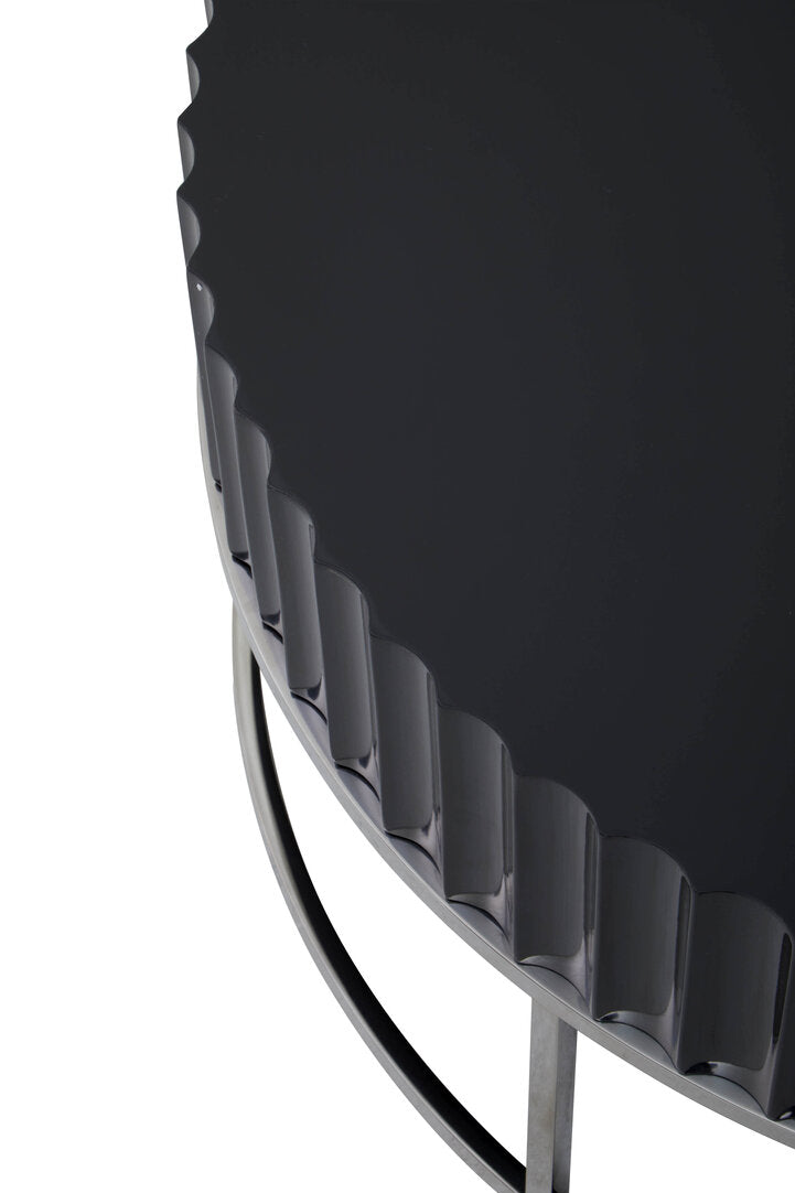 Detail of Round Black coffee table on stainless steel  base on white background