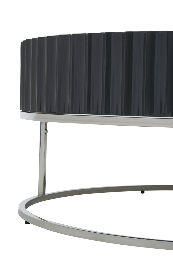 Side view of Round Black coffee table on stainless steel  base on white background