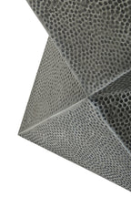 Close-up of a textured grey metal material