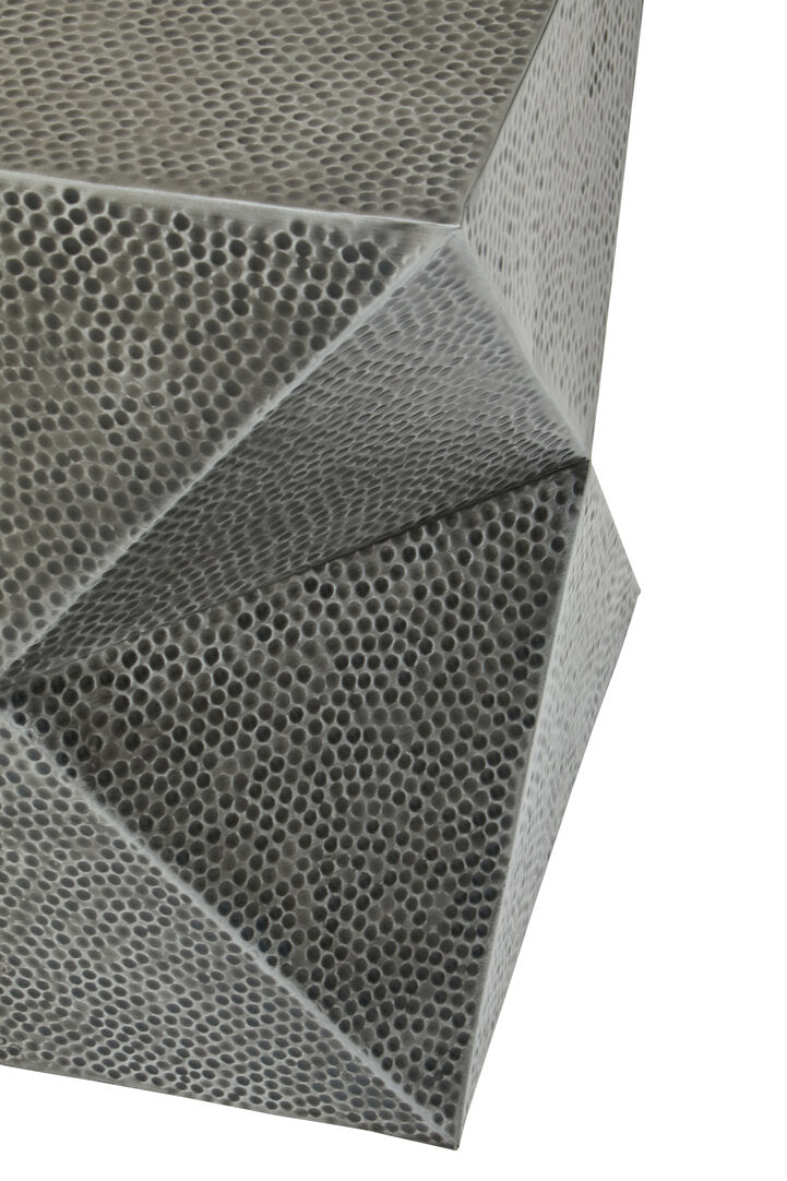 Close-up of a honeycomb-like metal on a white background