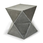 Geometric metal stool with a textured surface on a white background