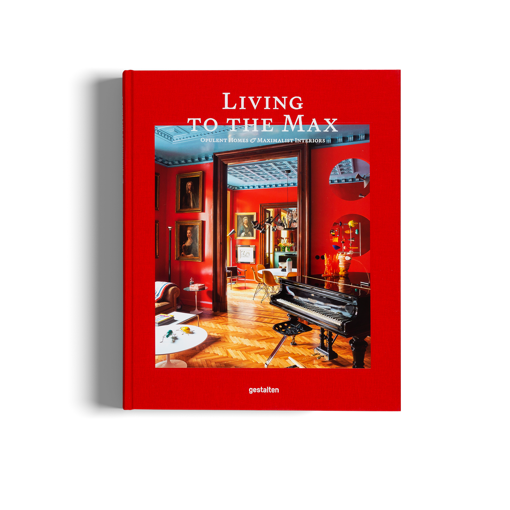 Book titled 'Living to the Max' with a red cover featuring an interior design image.