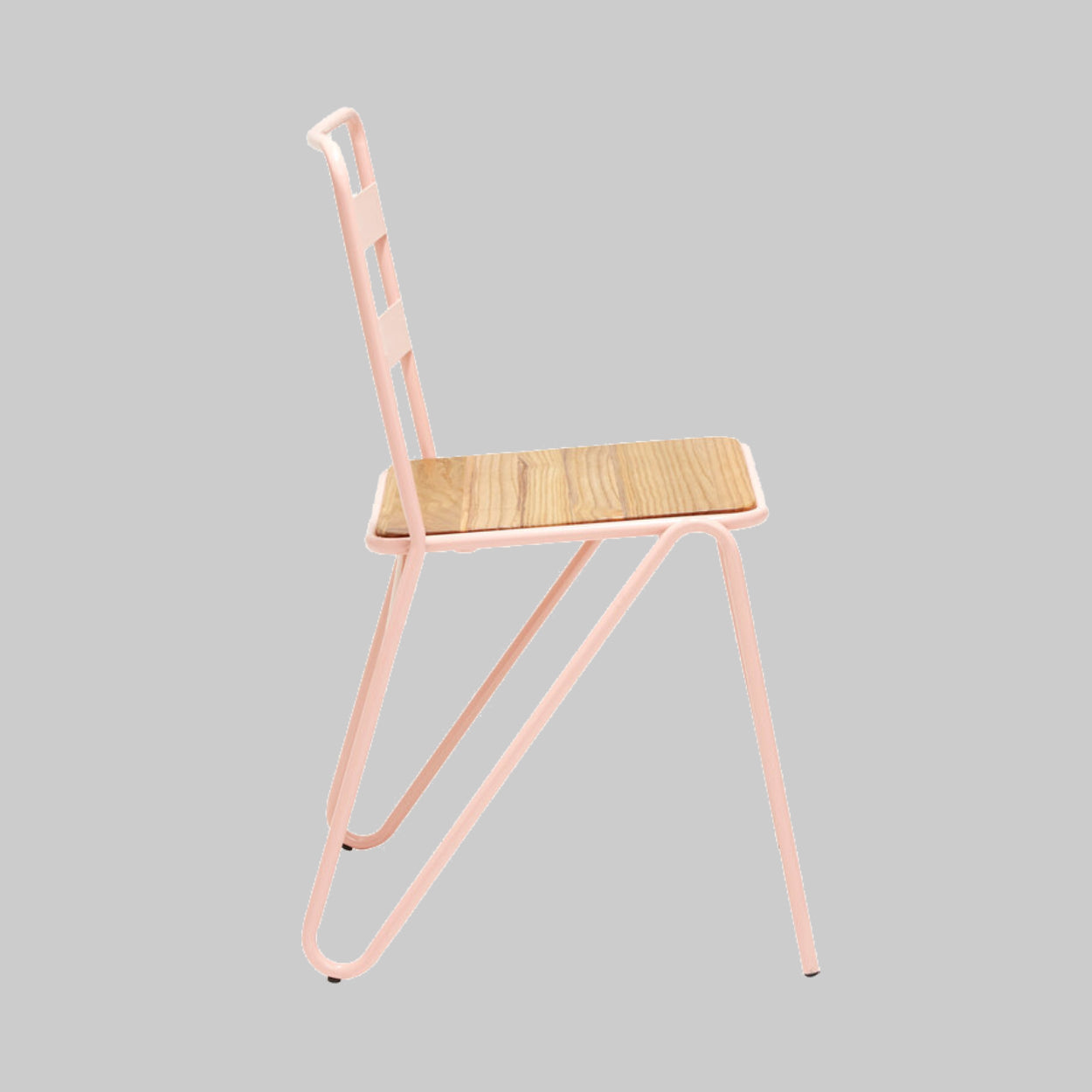 Chair with pink metal frame and wooden seat on a gray background