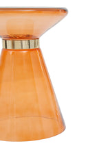 Orange glass side table with gold accent on a white background