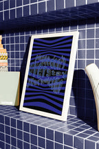 Please_dont_overstay_your_welcome_poster_in_white_frame_on_blue_tiles