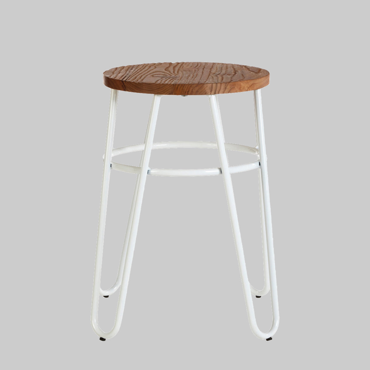 Bar stool with wooden seat and white metal legs on a gray background