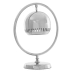 Chrome table lamp with a round shade on a white background
