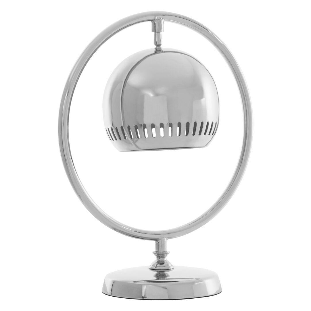 Chrome table lamp with a round shade on a white background