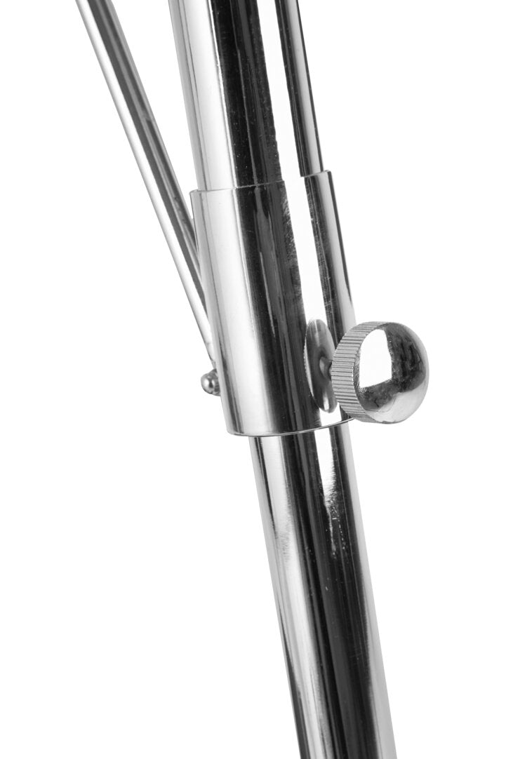 Close-up of a chrome lamp leg with a white background
