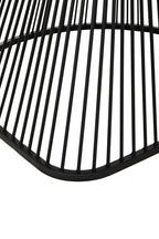 Close-up of a black metal chair with vertical slats on a white background