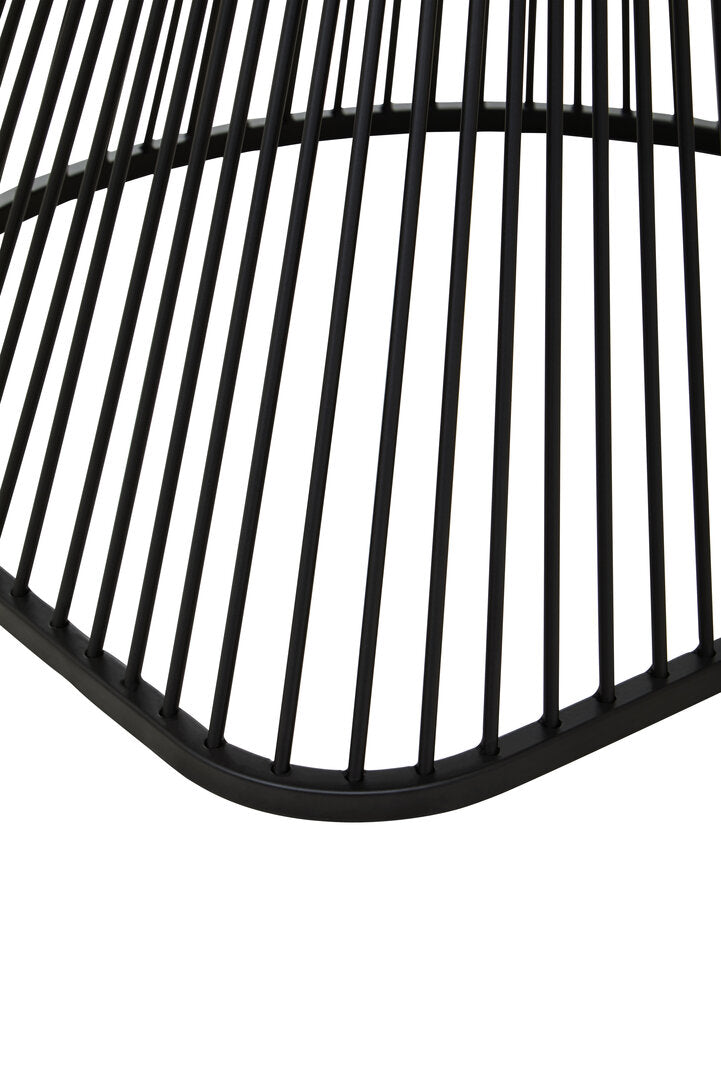 Close-up of a black metal chair with vertical slats on a white background
