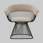 Modern lounge chair with black wire frame and beige cushion on a gray background