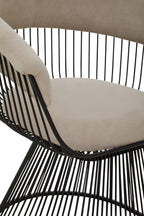 Beige cushioned chair with black metal wire frame on a white background