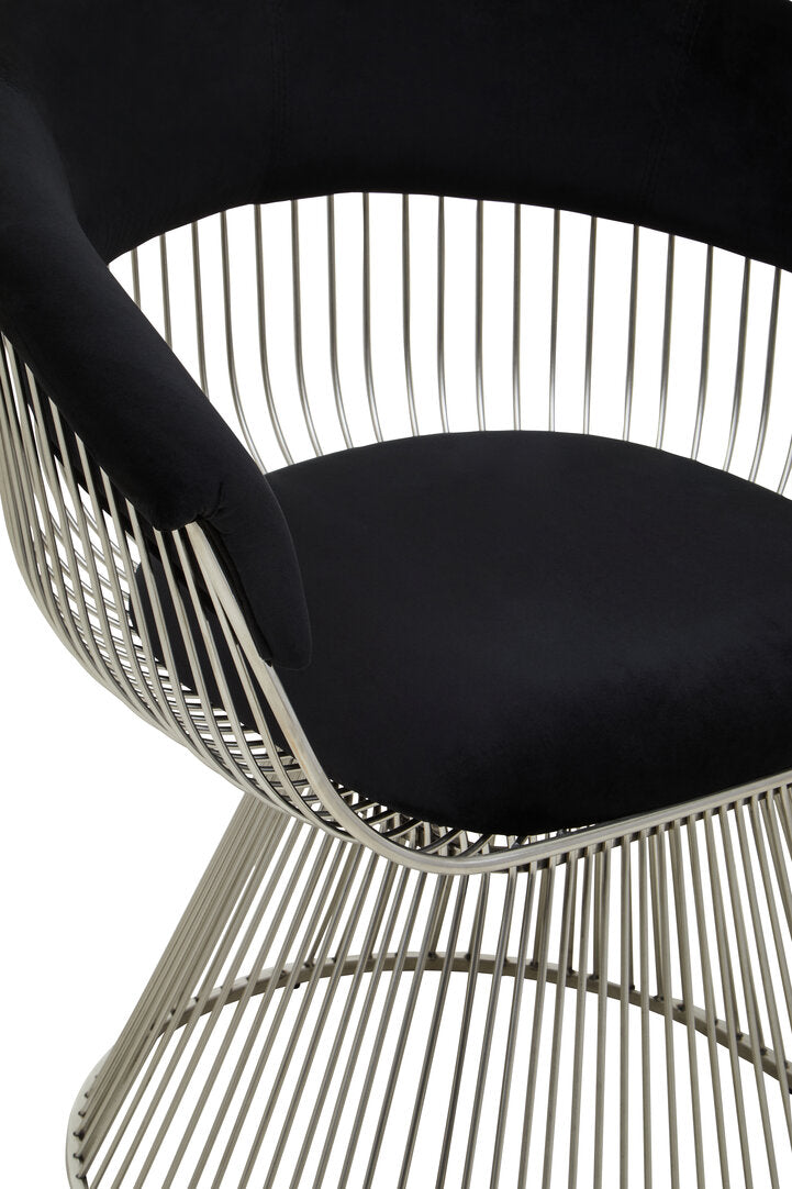 Modern wired lounge chair with black cushion and metal frame