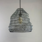 Woven metal pendant light with a neutral background
